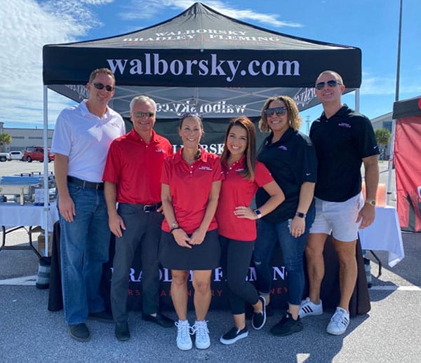 Five images of Walborsky, Bradley and Fleming staff at First Responders Grab & Go Luncheon held in the Panama City Mall parking lot on September 18th.